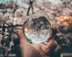 A picture of crystal ball being held by a hand