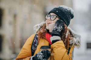 A woman talking on the phone in the winter