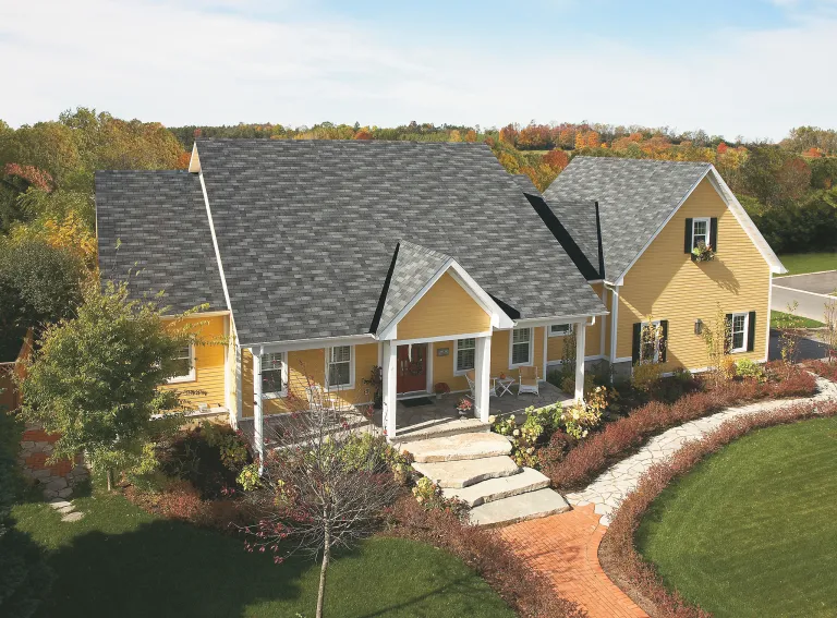 Bright yellow siding matched to grey shingles